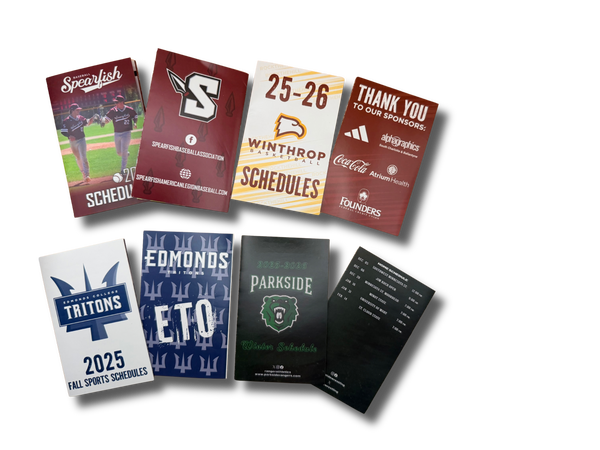 Collection of sports pocket schedules and thank you cards on a white background